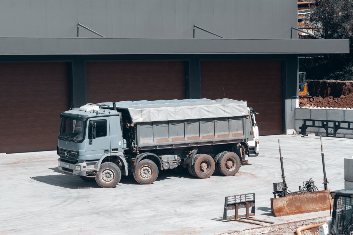 Dump truck on the yard of a modern waste transfer facility